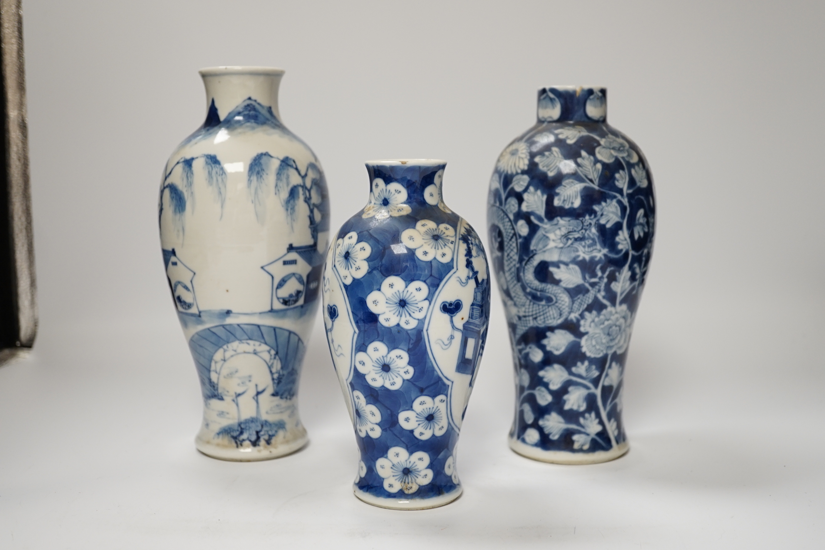 Three 19th century Chinese blue and white vases, tallest 23.5cm